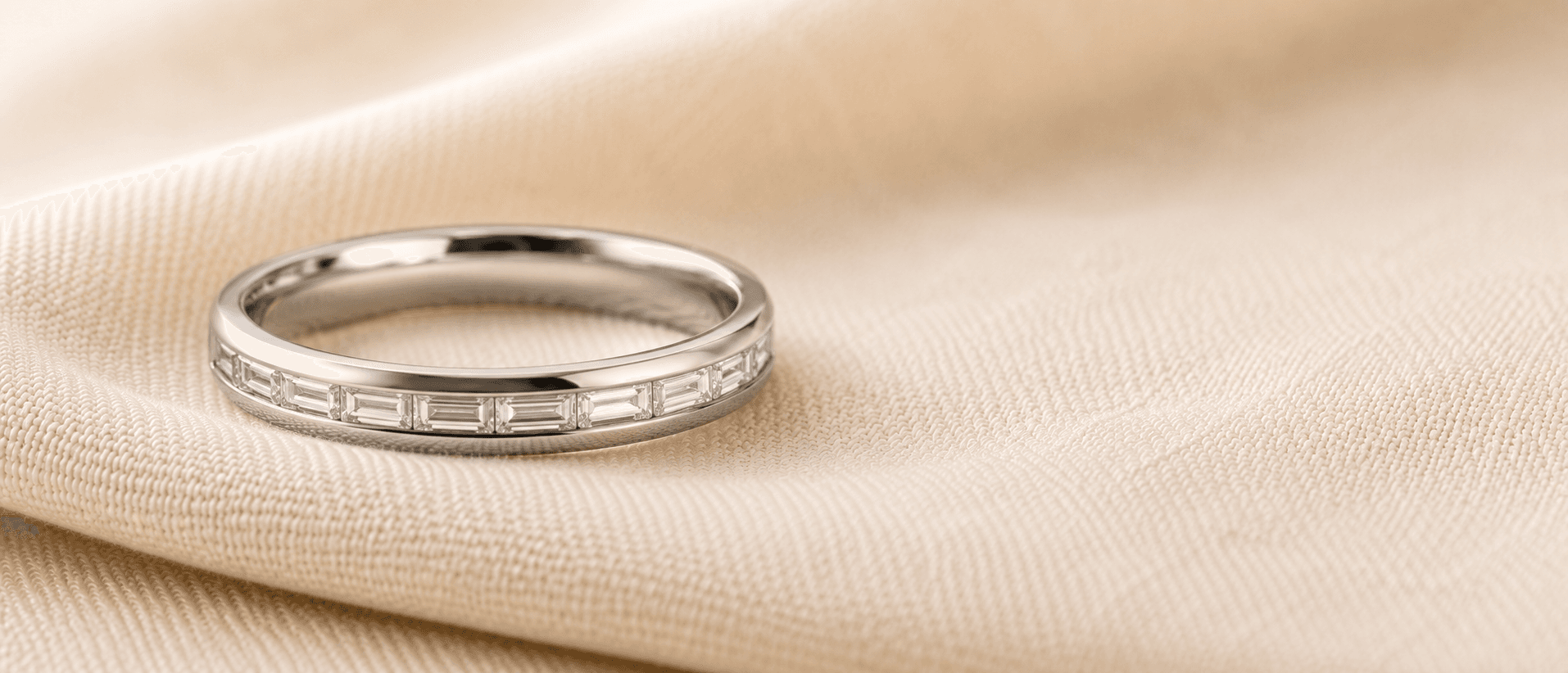 Channel-set baguette diamond wedding band in platinum, handcrafted at ATL Luxury Jewelers in Atlanta