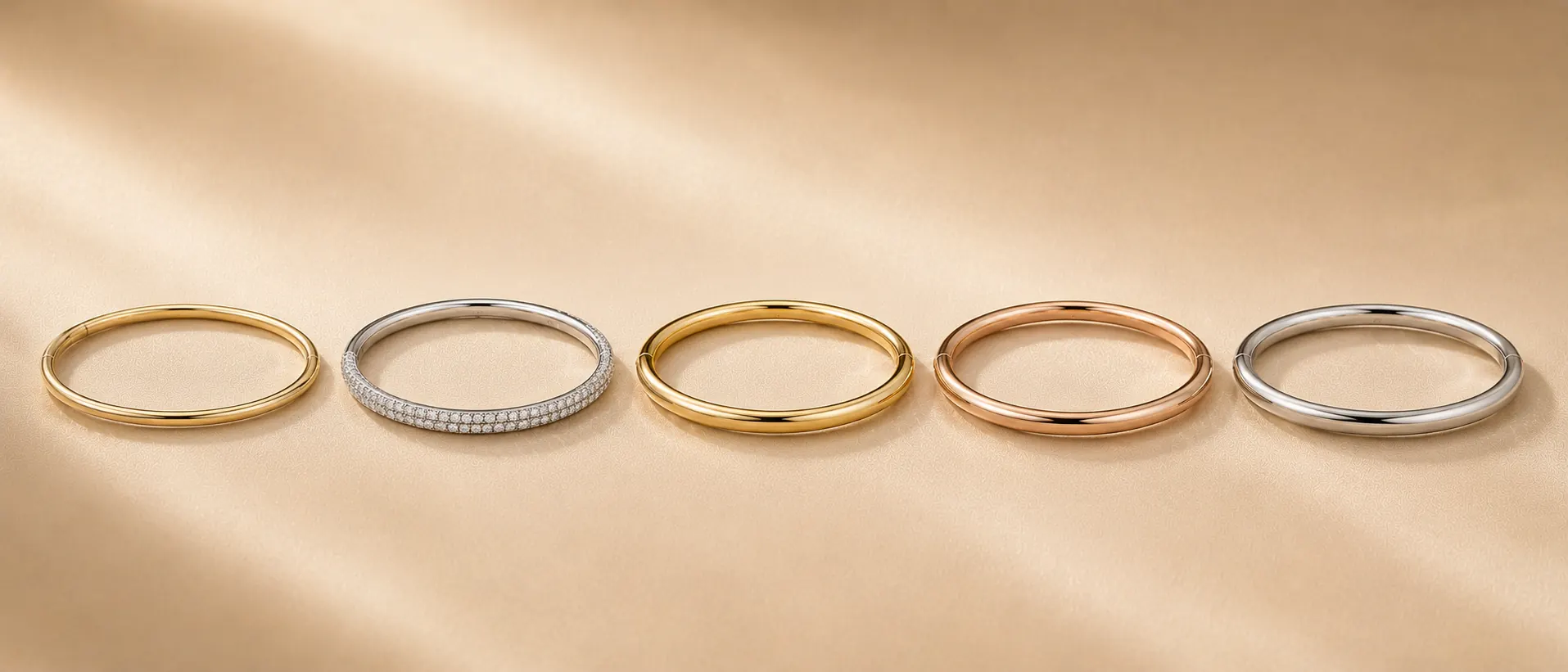 Stack of gold and diamond bangles at ATL Luxury Jewelry Atlanta