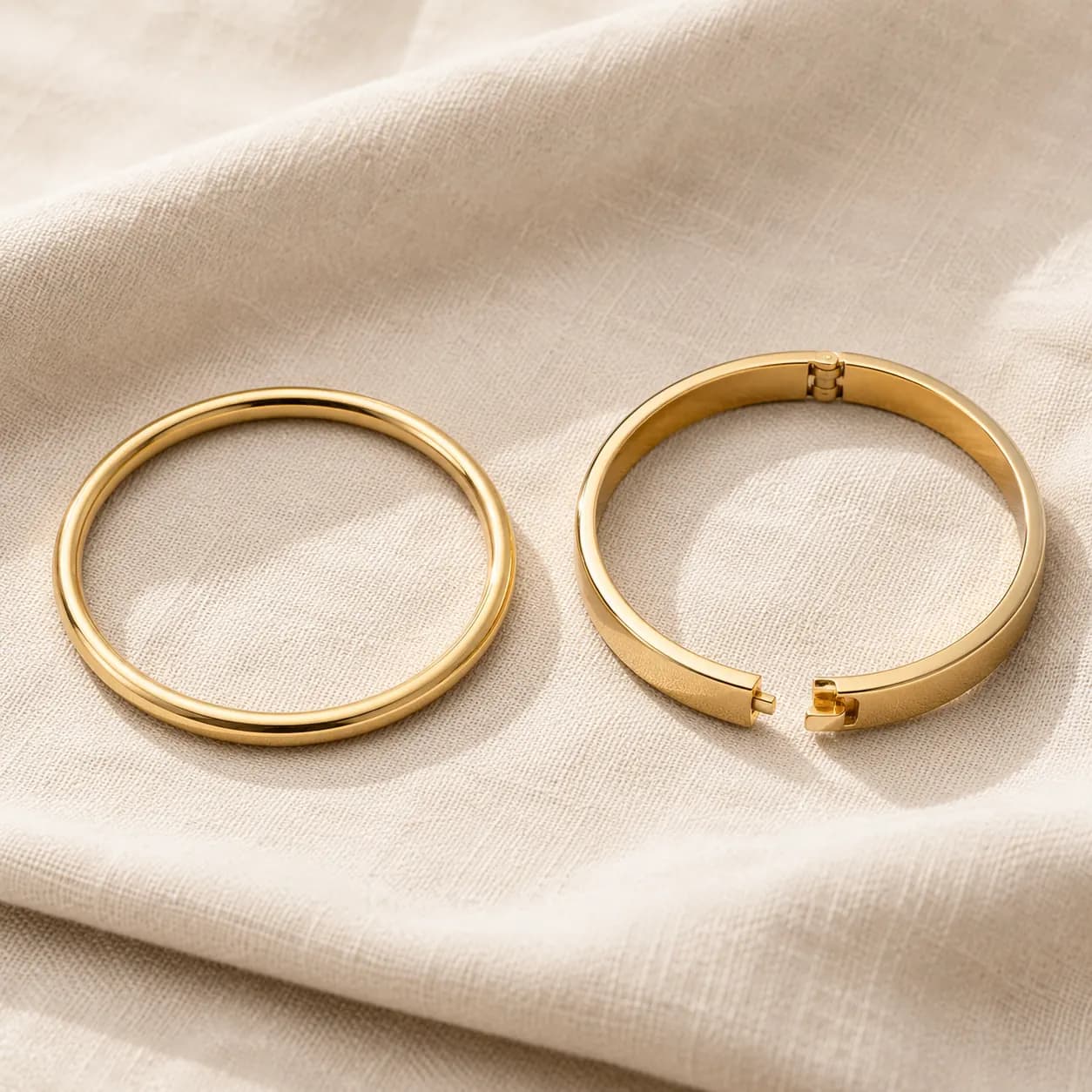 Solid gold bangle and hinged gold bangle at ATL Luxury Jewelers Atlanta