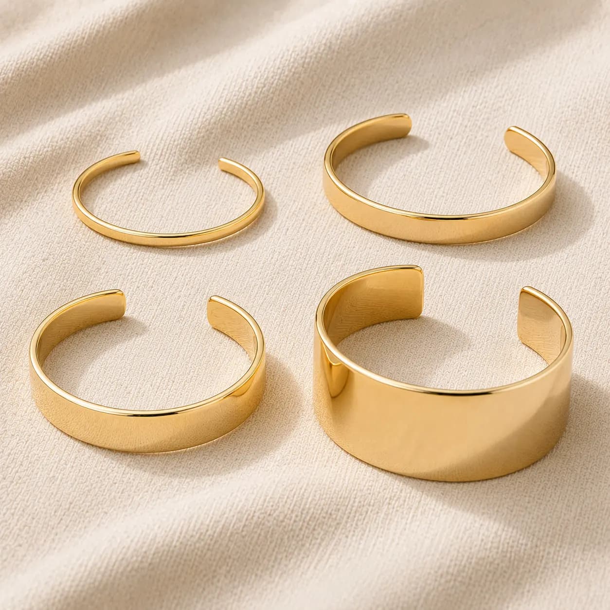 Gold cuff bracelets in different widths — thin, medium, and wide statement cuffs at ATL Luxury Jewelry Atlanta