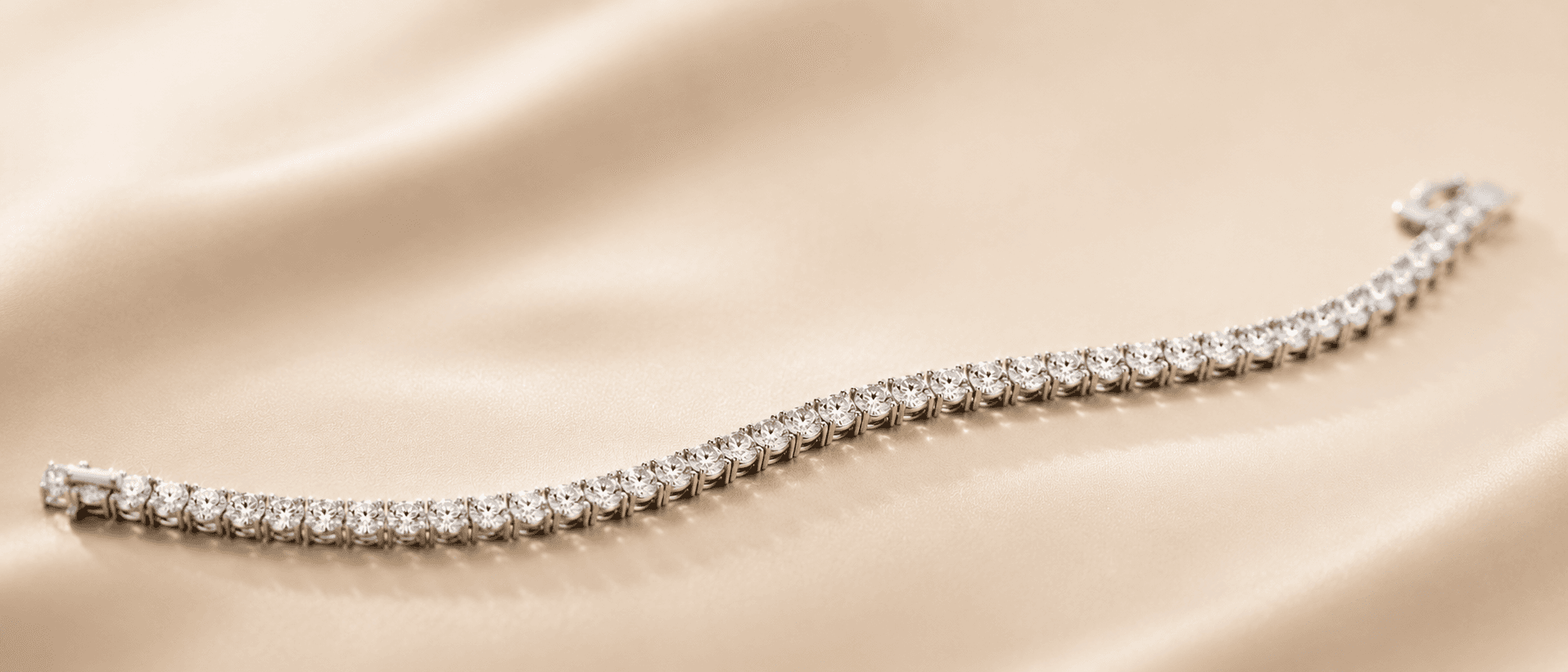 Diamond tennis bracelet on cream linen at ATL Luxury Jewelers Atlanta