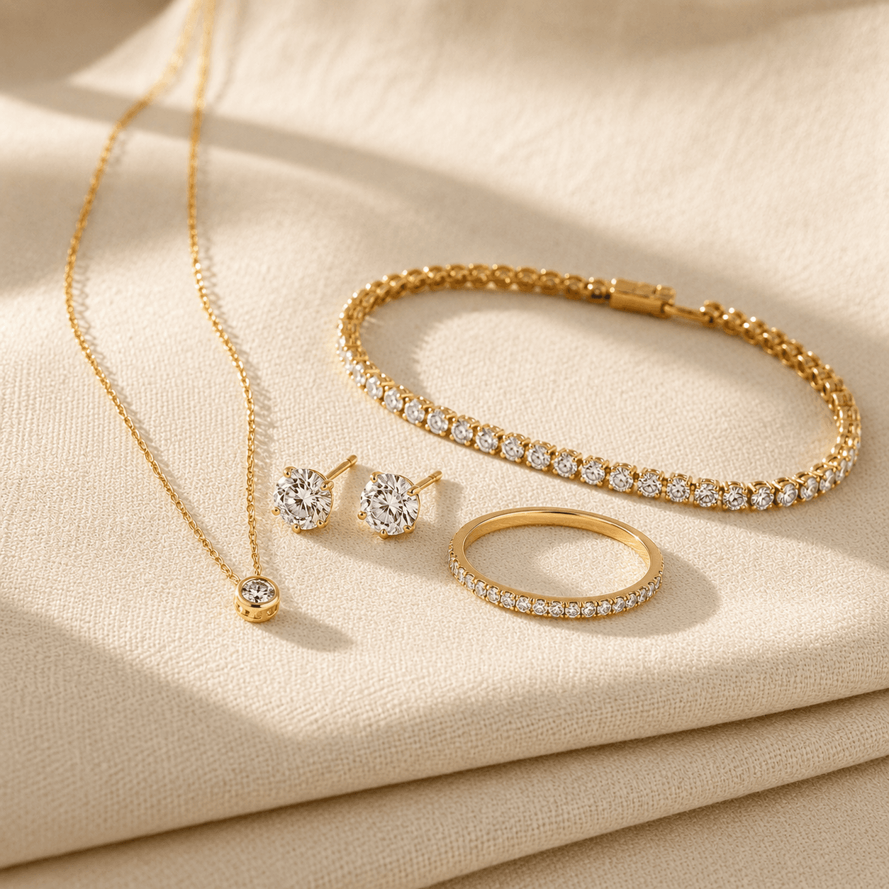 Women's fine jewelry collection — gold necklaces, diamond stud earrings, tennis bracelets, and signature rings at ATL Luxury Jewelers Atlanta