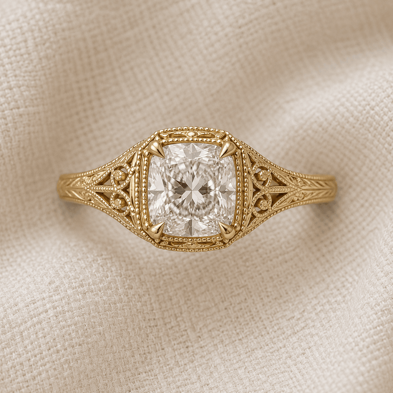 Antique-inspired cushion cut engagement ring with filigree and milgrain detailing