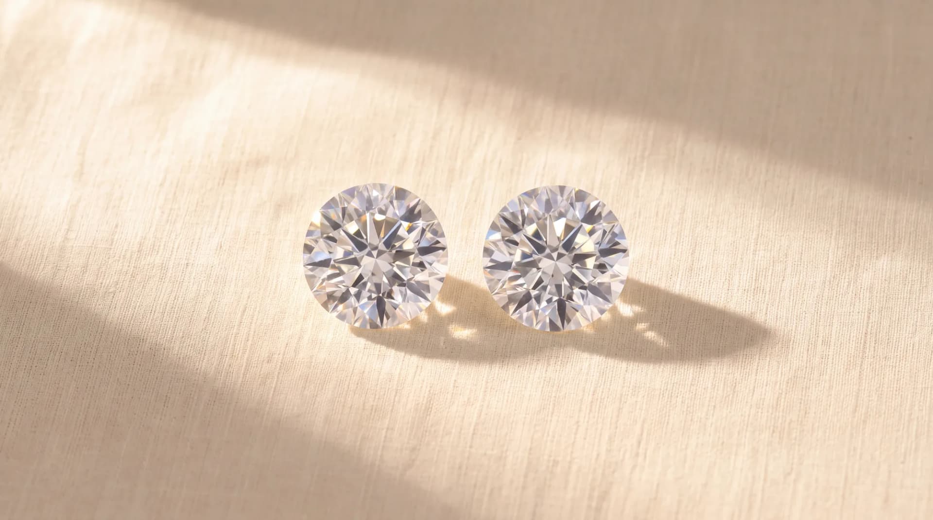 A lab-grown diamond and a natural diamond of equal size side by side.