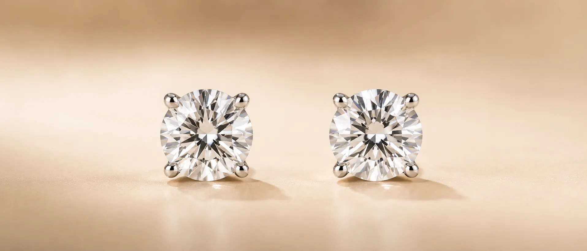 Diamond stud earrings on cream linen at ATL Luxury Jewelry Atlanta