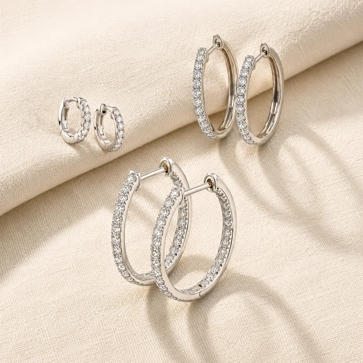 Diamond huggies, pavé diamond hoops, and inside-outside diamond hoops at ATL Luxury Jewelry Atlanta