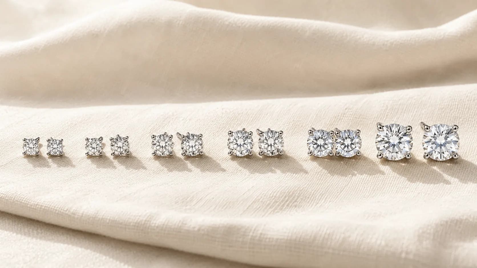 Diamond stud earrings in 0.25, 0.5, 1, 2, 3, and 4 carat total weight progression at ATL Luxury Jewelry Atlanta
