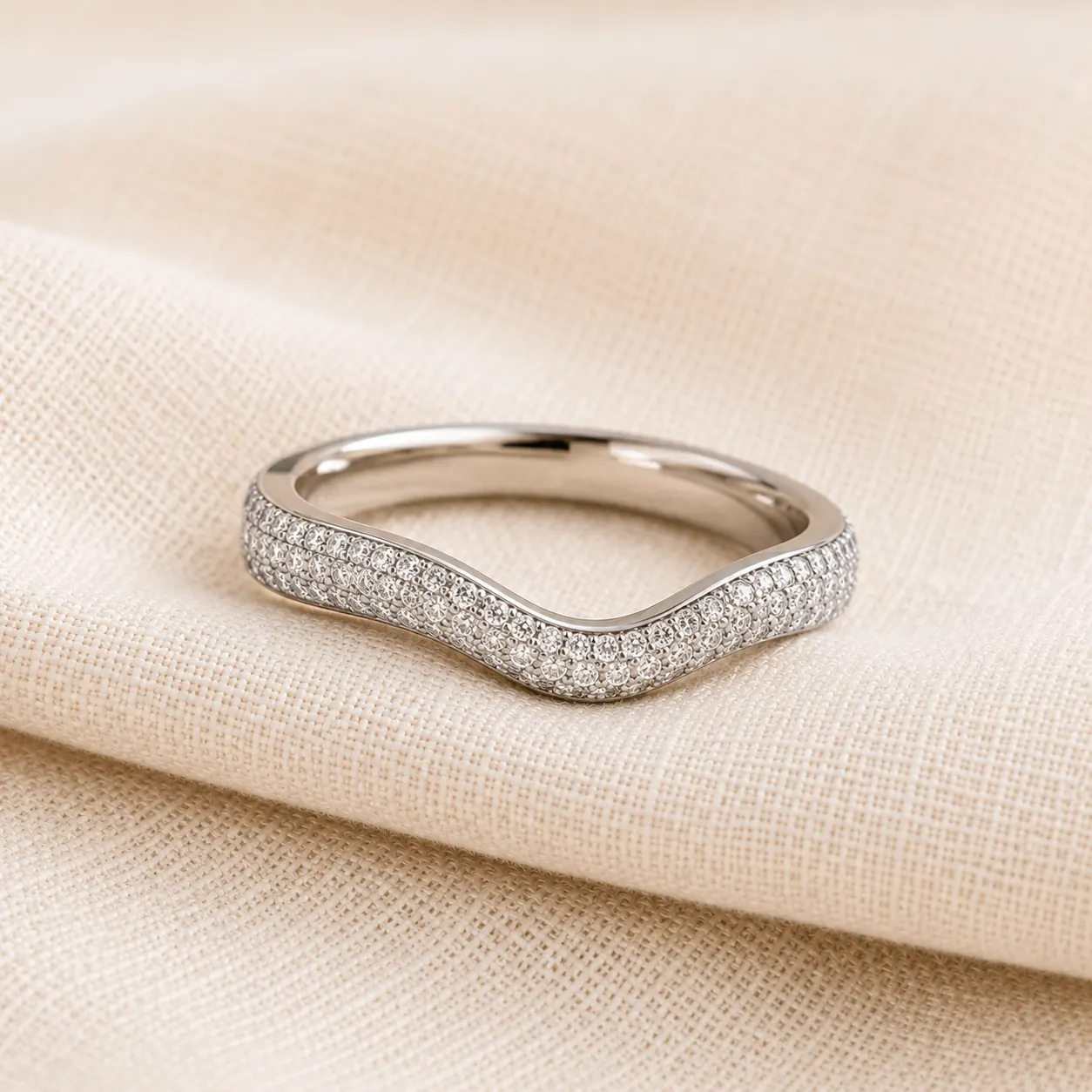 Diamond ring enhancer with pavé diamonds across the curve at ATL Luxury Jewelers Atlanta