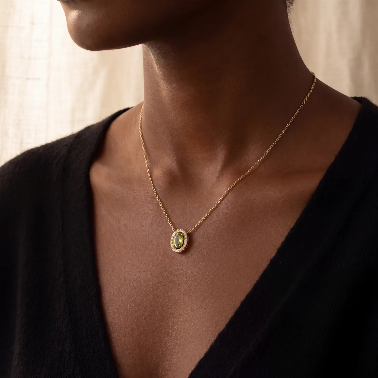 A selection of gold and diamond jewelry gifts for her on cream linen