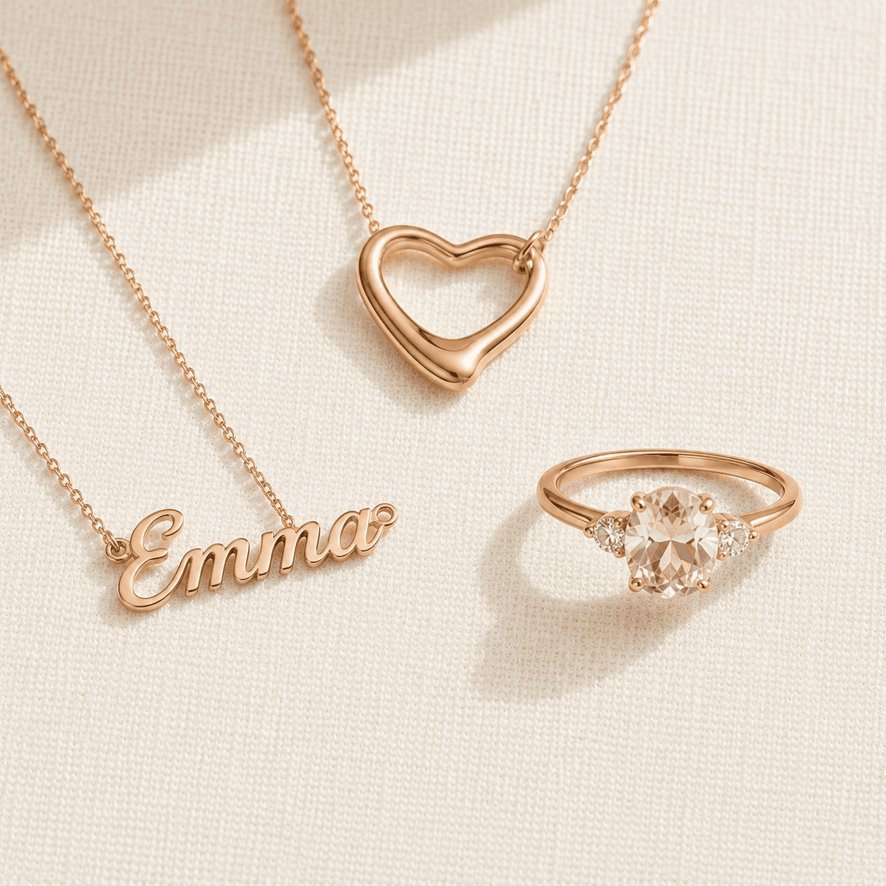 Romantic jewelry pieces — heart pendant, name necklace, gemstone ring at ATL Luxury Jewelers