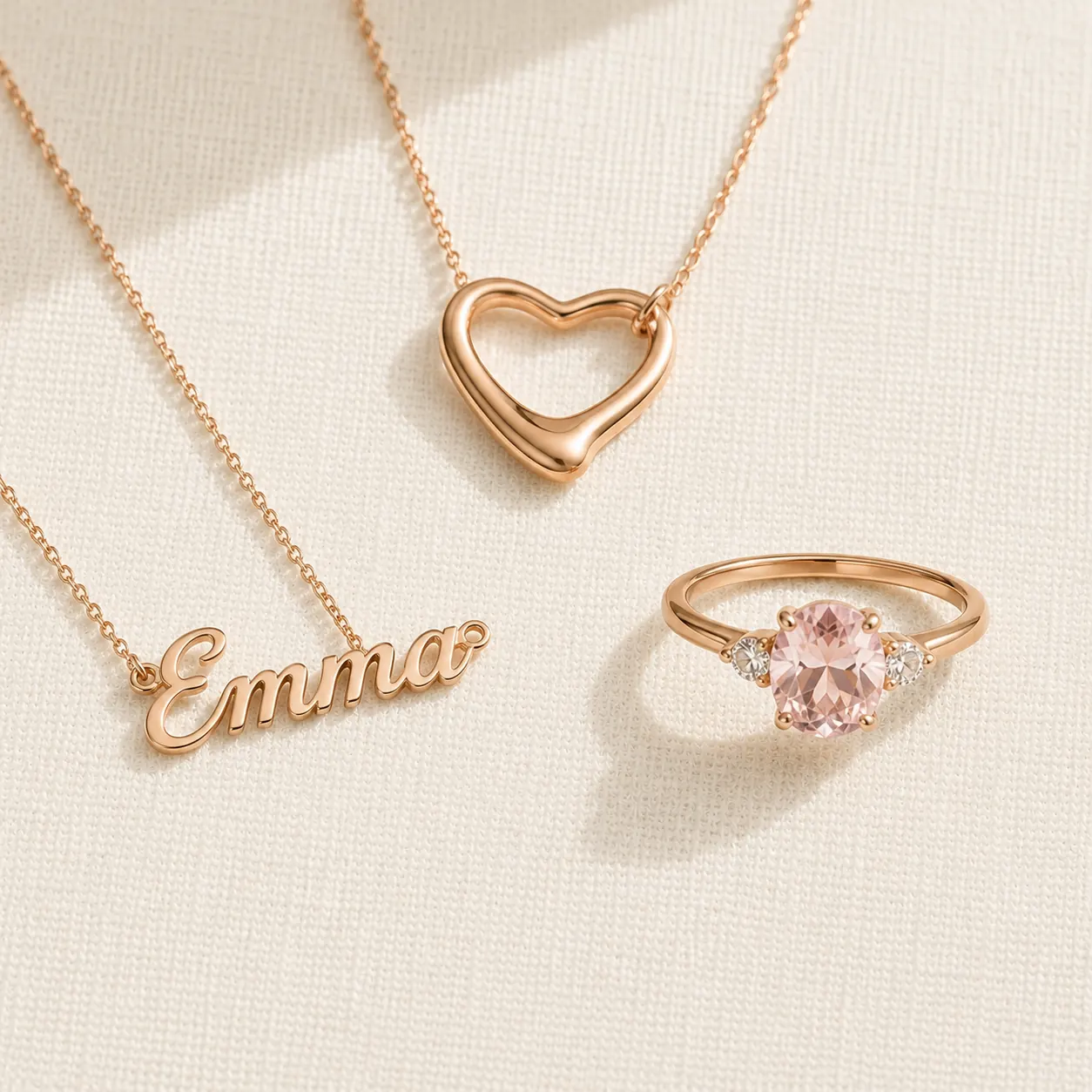 Romantic jewelry pieces — heart pendant, name necklace, gemstone ring at ATL Luxury Jewelers