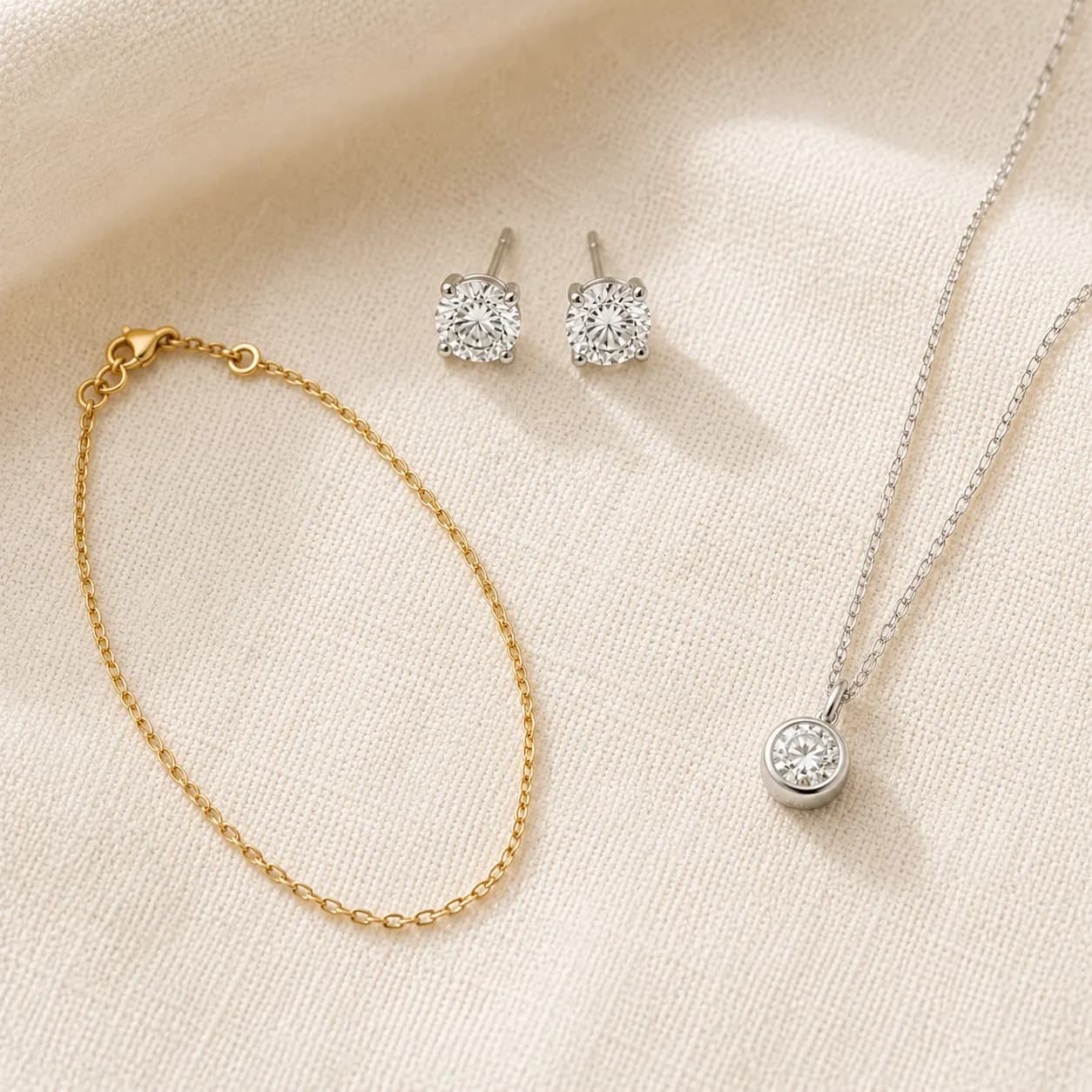 Safe jewelry gift picks — diamond studs, delicate gold chain, bezel pendant at ATL Luxury Jewelry Atlanta