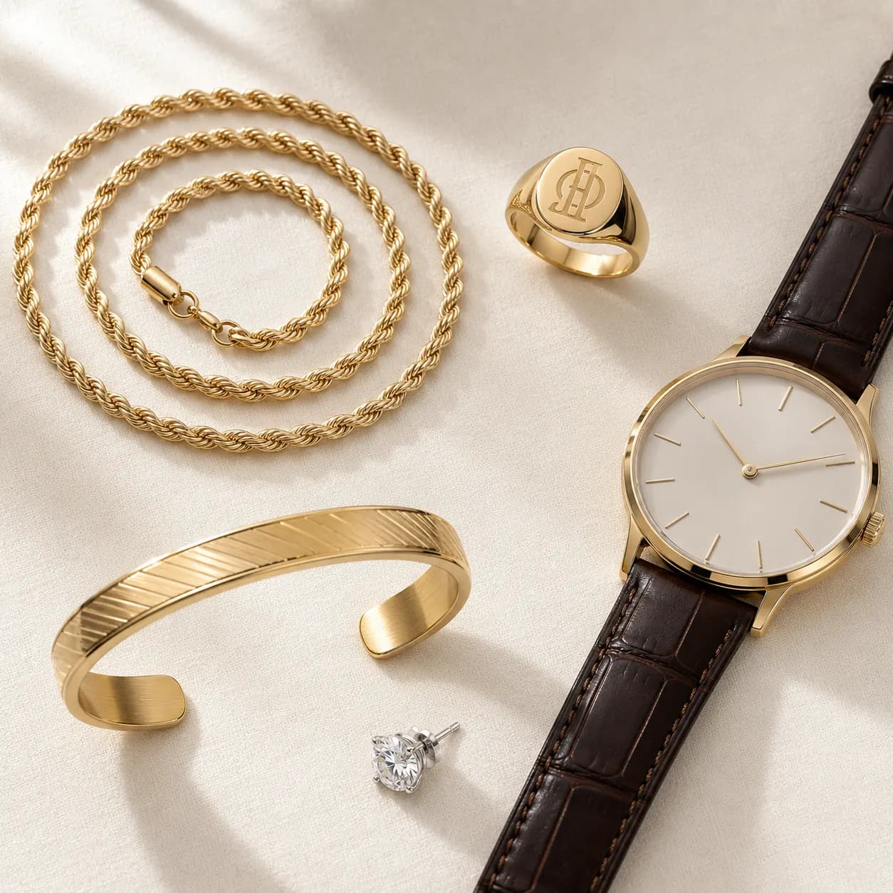 Men's jewelry gift categories — gold chain, signet ring, cuff bracelet, watch at ATL Luxury Jewelry Atlanta