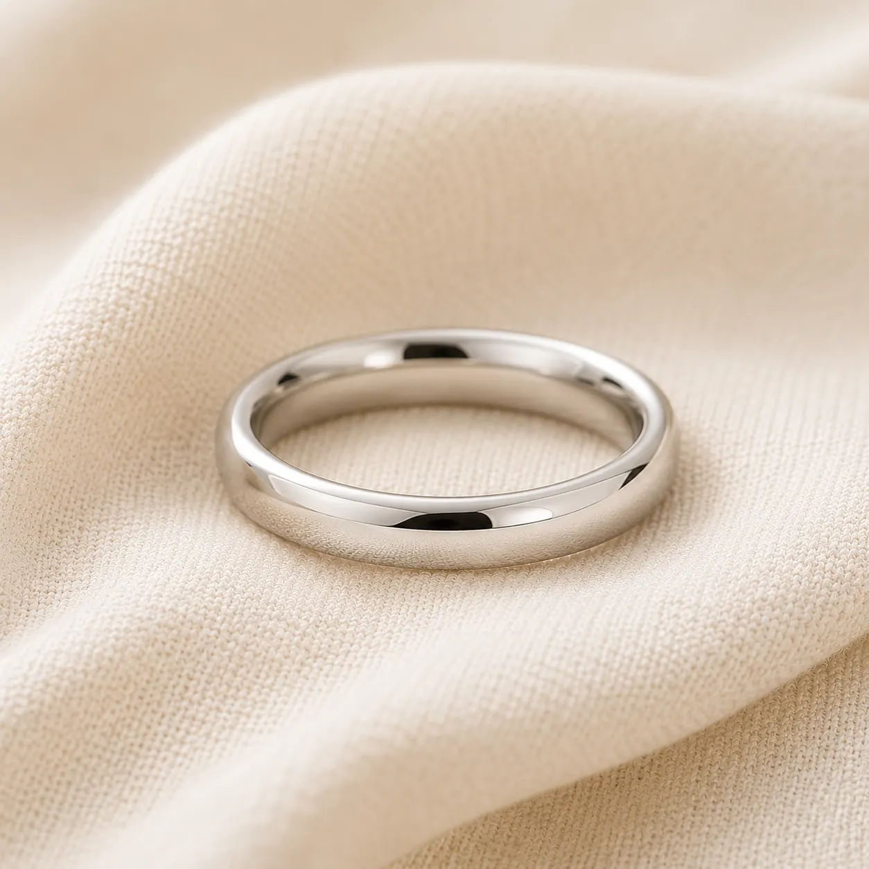 14K white gold wedding band on cream linen at ATL Luxury Jewelry Atlanta