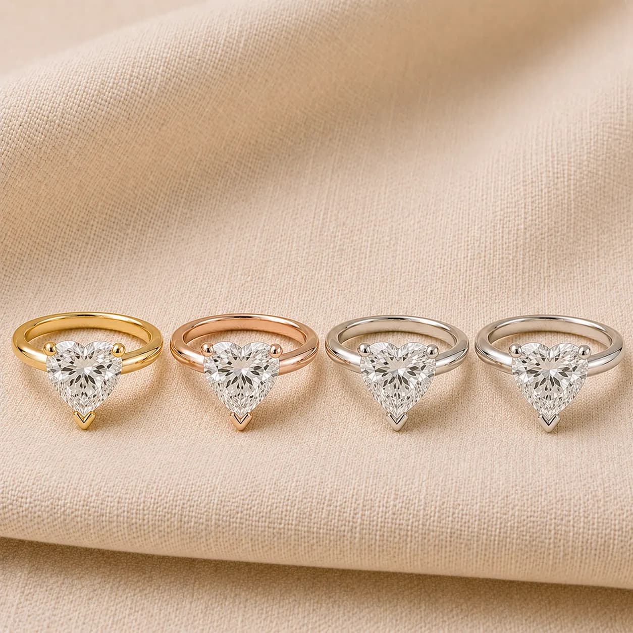 Heart shaped engagement rings shown in white gold, yellow gold, rose gold, and platinum at ATL Luxury Jewelry Atlanta