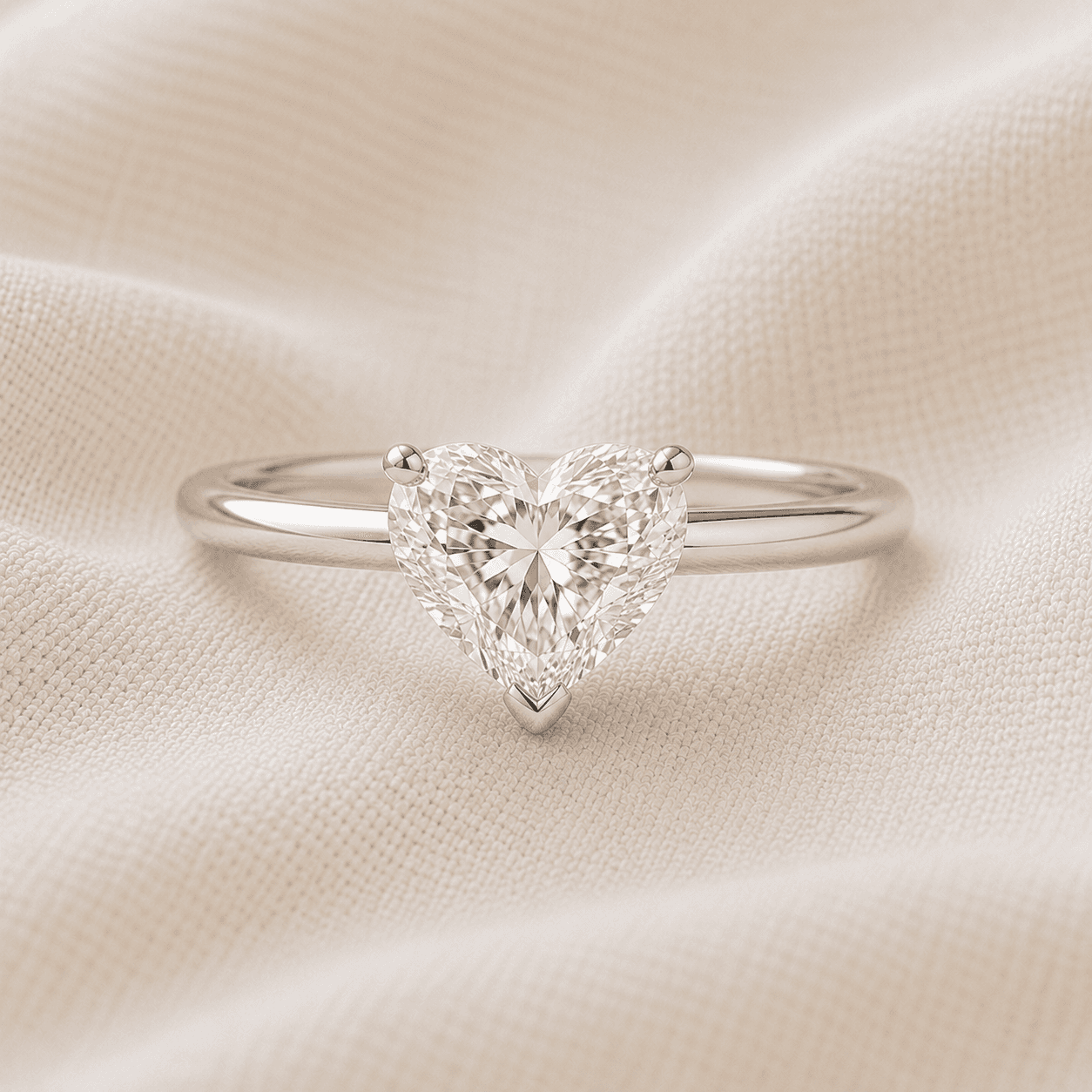 Heart shaped solitaire engagement ring with three-prong setting