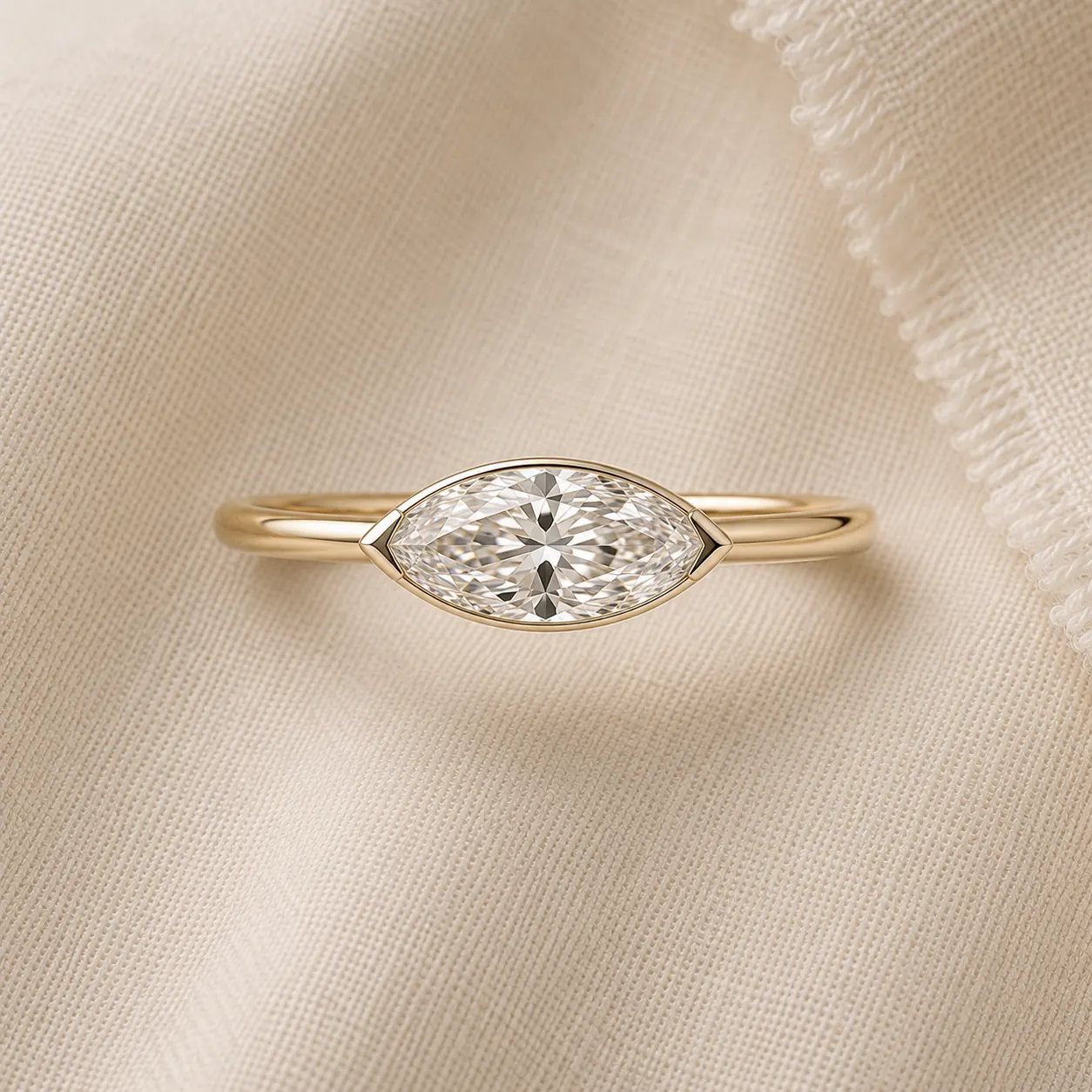 East-west marquise engagement ring set horizontally in yellow gold