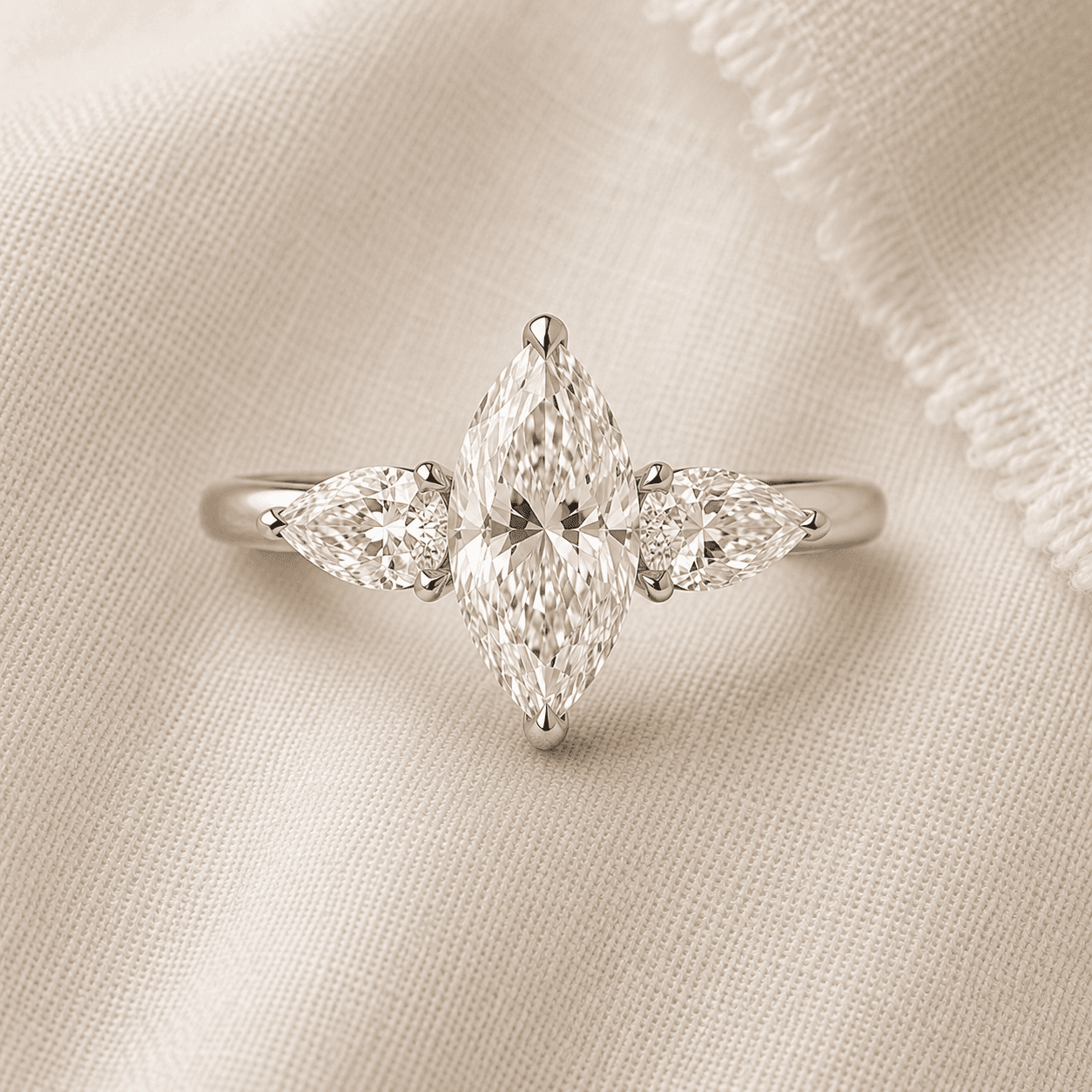 Marquise cut three stone engagement ring