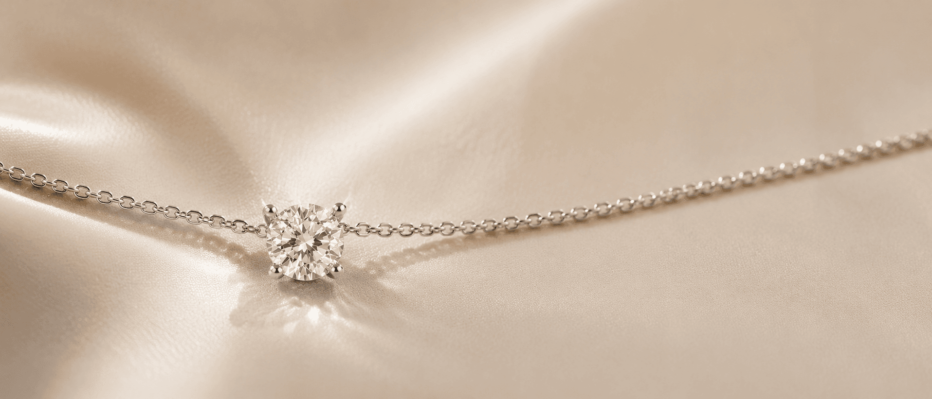Diamond pendant necklace on cream linen at ATL Luxury Jewelers Atlanta