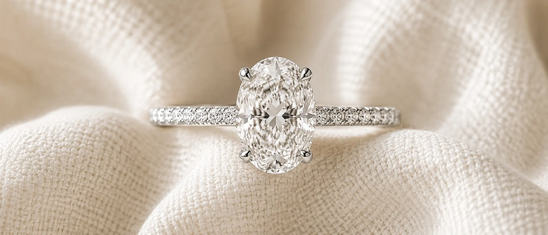Oval cut diamond engagement ring with pavé band, handcrafted at ATL Luxury Jewelers in Atlanta