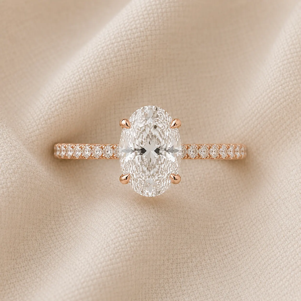 Oval cut engagement ring with pavé diamond band in rose gold