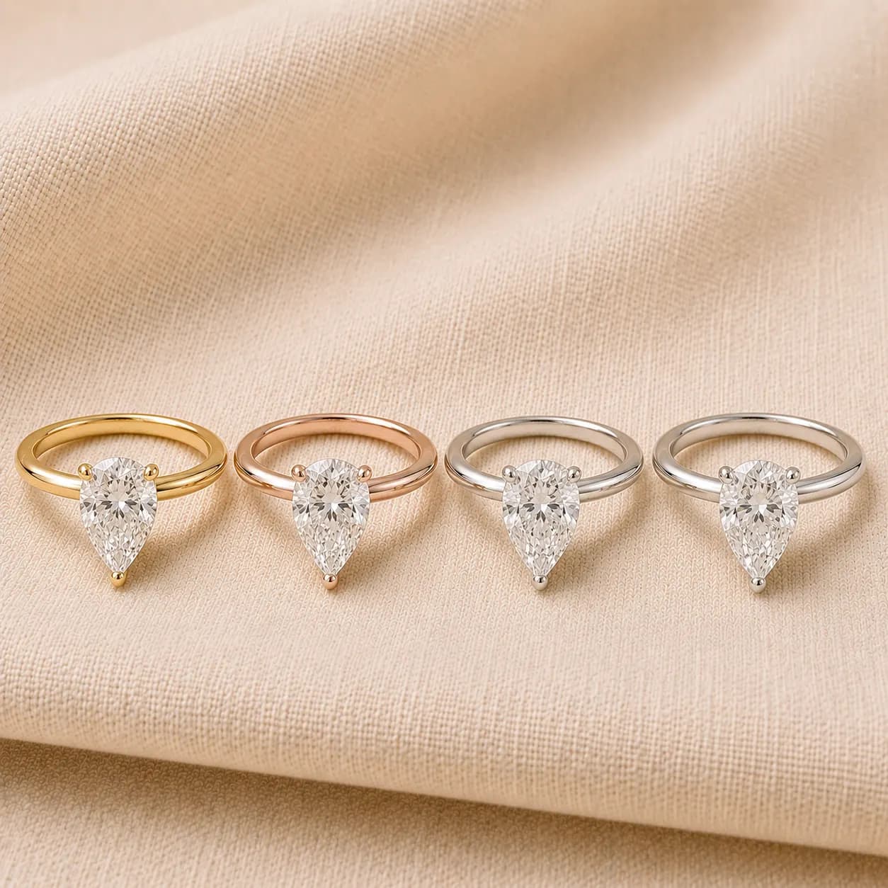 Pear shaped engagement rings in white gold, yellow gold, rose gold, and platinum at ATL Luxury Jewelers Atlanta