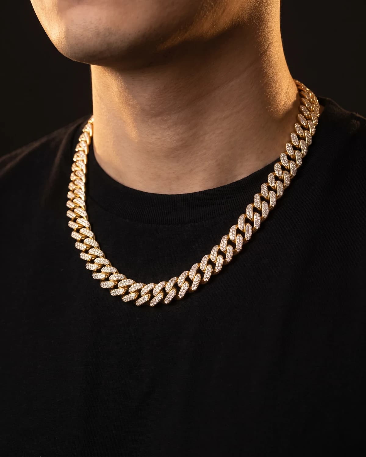 Design prototype — a rendering of an iced yellow gold Cuban link chain worn at the collarbone, a piece ATL Luxury Jewelry can make for you.