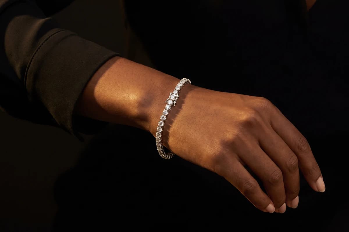 Design prototype — a rendering of a white gold diamond tennis bracelet worn at the wrist, a piece ATL Luxury Jewelry can make for you.