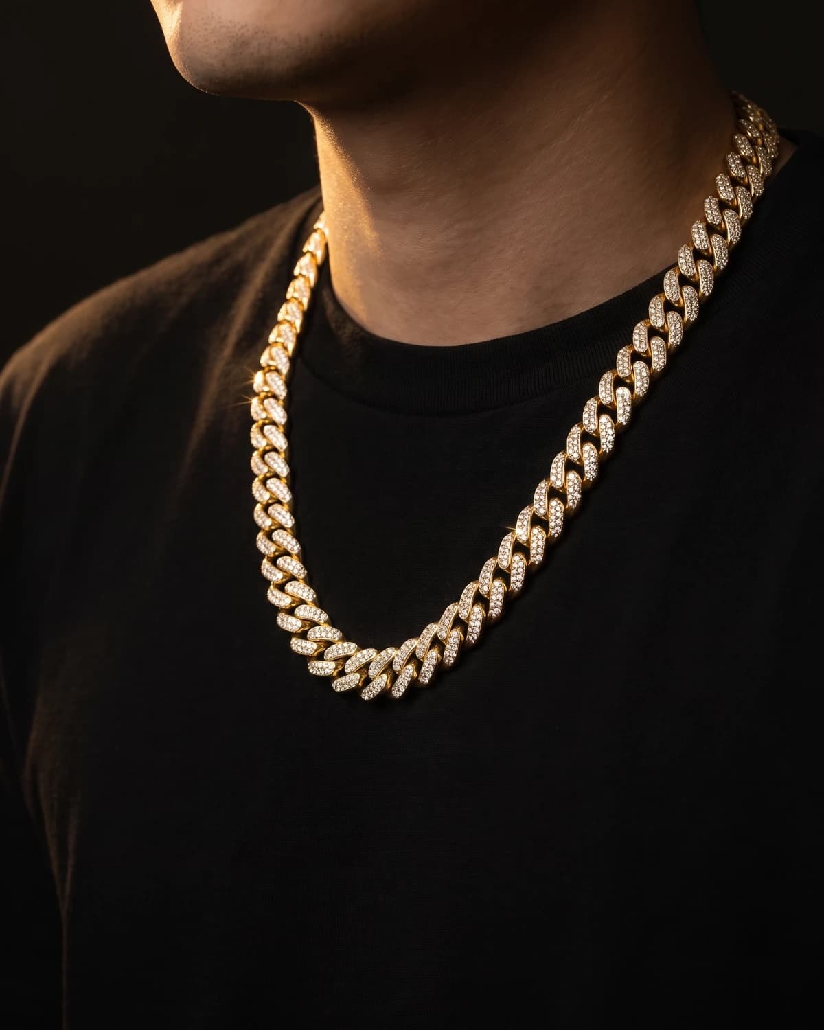 Design prototype — a rendering of an iced yellow gold Cuban link chain worn at the collarbone, a piece ATL Luxury Jewelry can make for you.