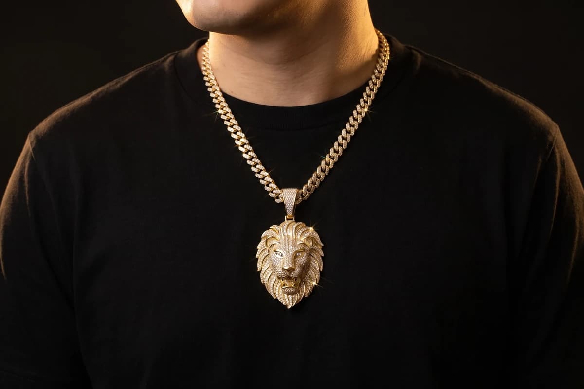 Design prototype — a rendering of an iced yellow gold Cuban chain with a pavé diamond lion-head pendant worn at the chest, a piece ATL Luxury Jewelry can make for you.