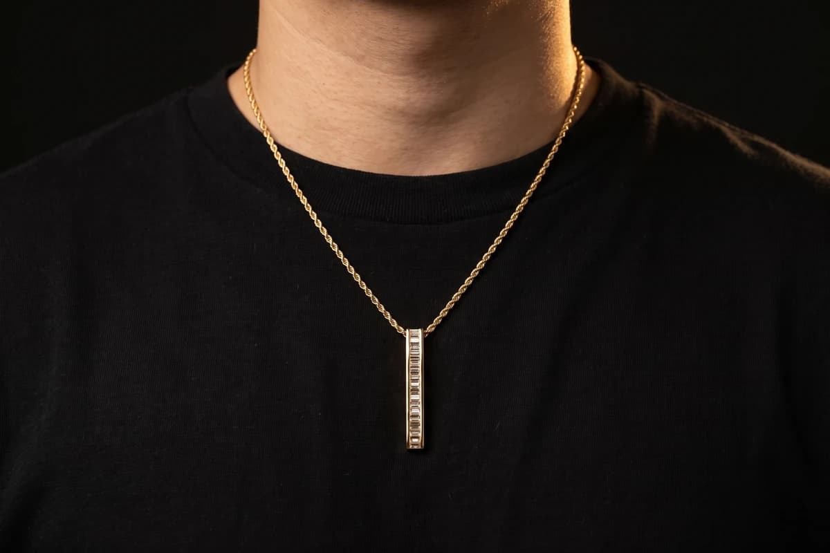 Design prototype — a rendering of a baguette diamond bar pendant on a gold rope chain worn at the chest, a piece ATL Luxury Jewelry can make for you.