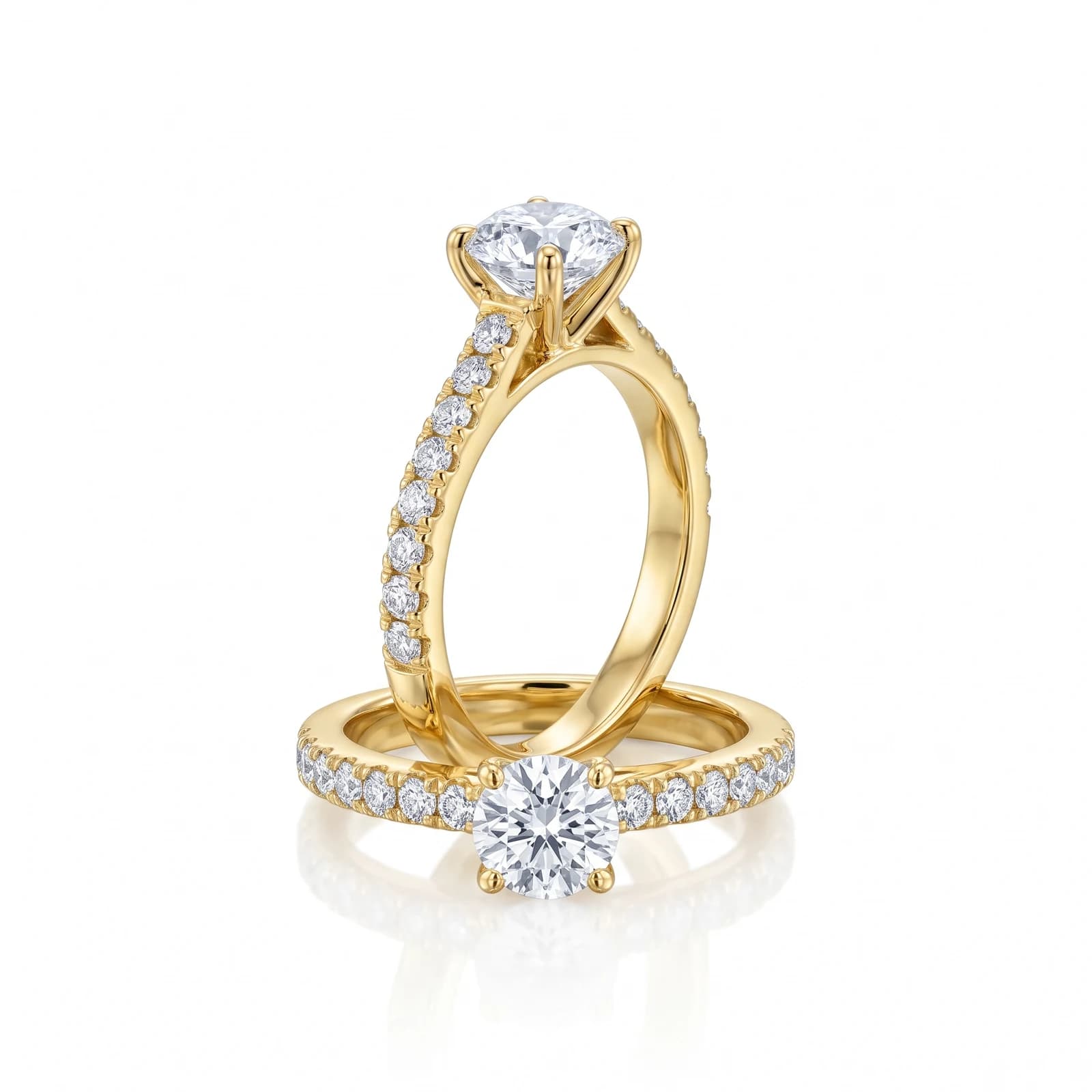 Design prototype — a rendering of a yellow gold round solitaire engagement ring nested with its pavé wedding band