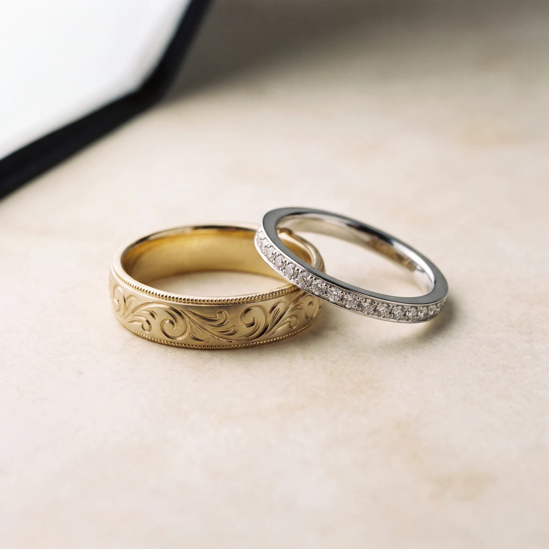 Design prototype — a rendering of a matched pair of wedding bands in brushed yellow gold and polished white gold