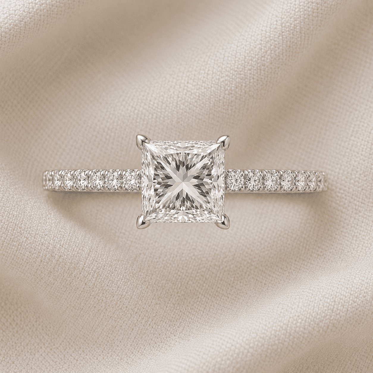 Princess cut engagement ring with pavé diamond band in platinum