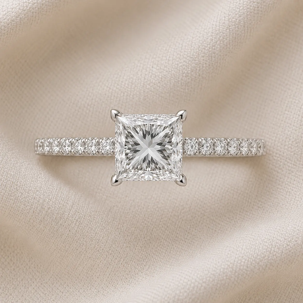Princess cut engagement ring with pavé diamond band in platinum
