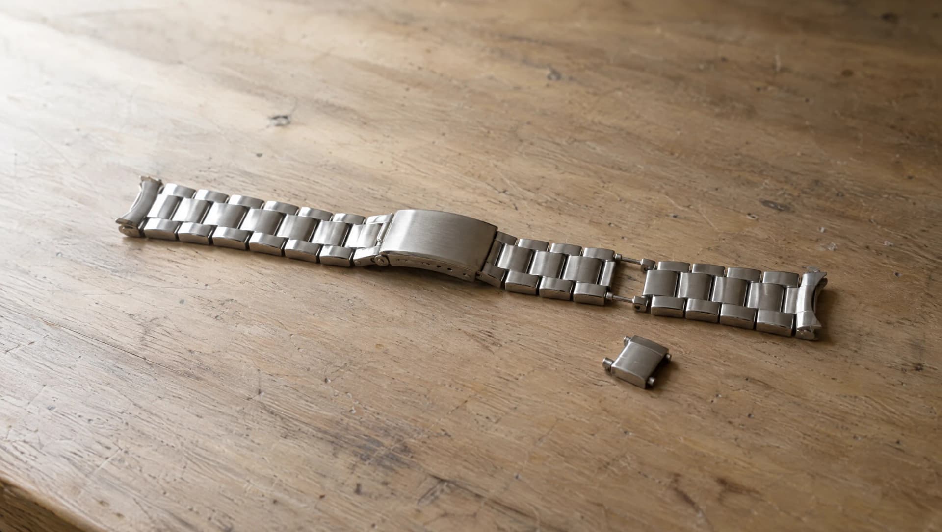 Watch bracelet link removal on a jeweler's work surface at ATL Luxury Jewelry, Snellville GA