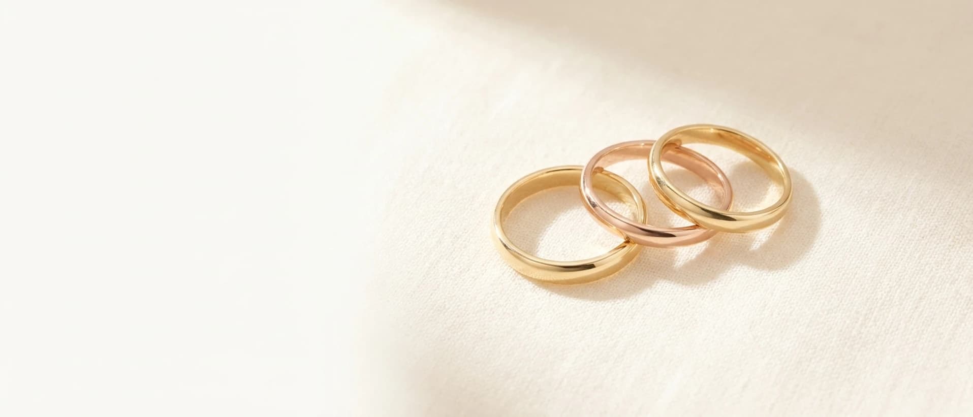 10K gold rings on cream linen at ATL Luxury Jewelry Atlanta
