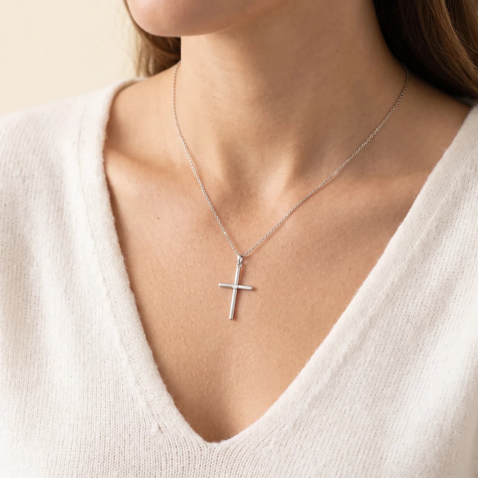 White gold diamond cross pendant necklace worn