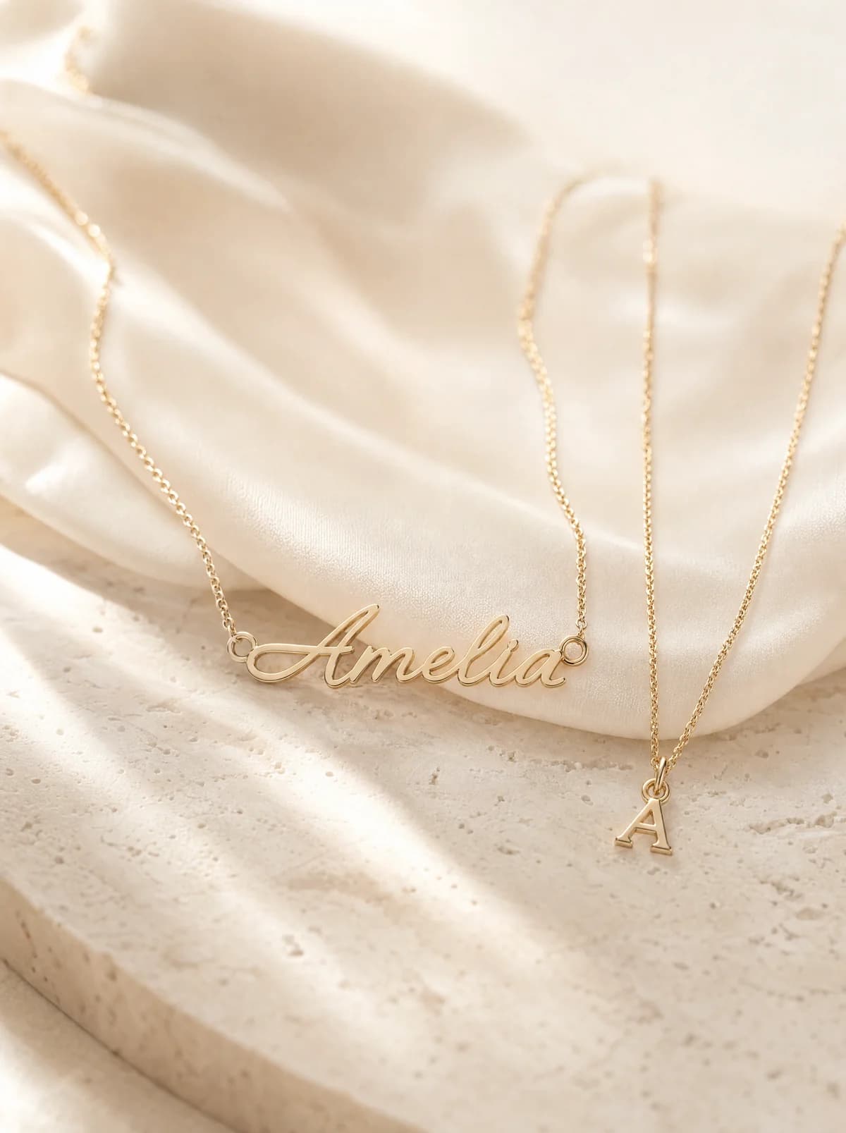 Gold nameplate and initial necklaces