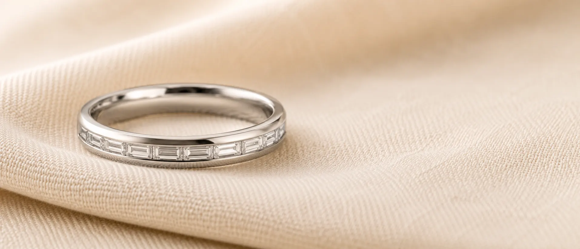 Vintage Art Deco milgrain wedding band in platinum on cream linen at ATL Luxury Jewelry Atlanta