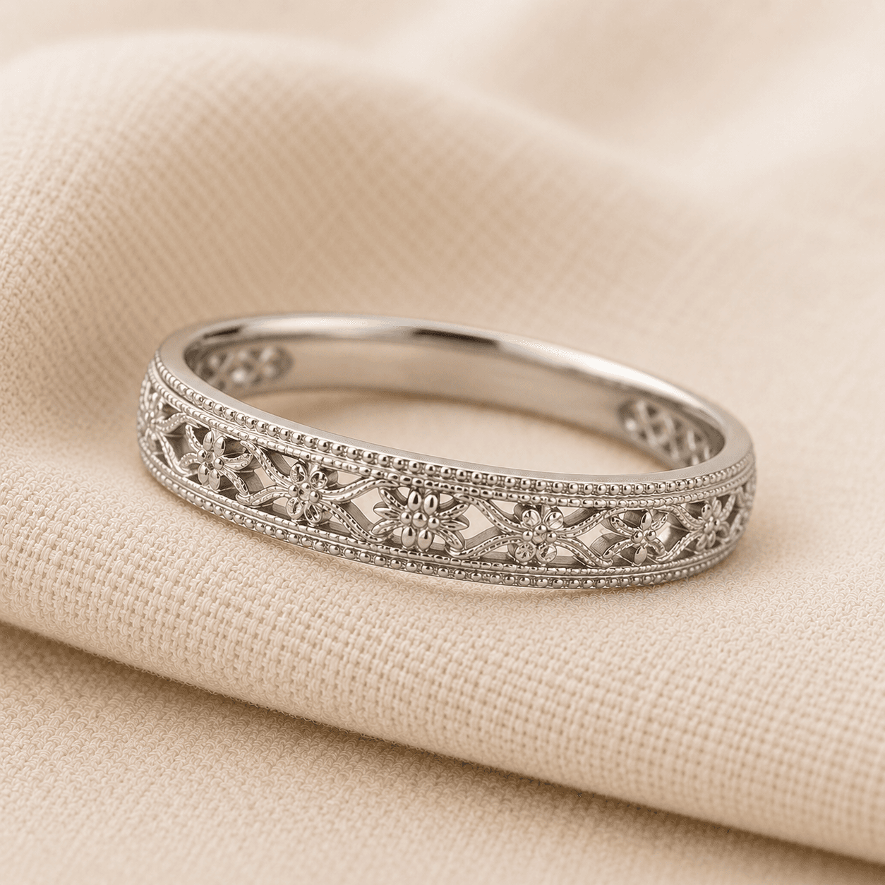Vintage milgrain and filigree wedding band detail on cream linen at ATL Luxury Jewelers Atlanta