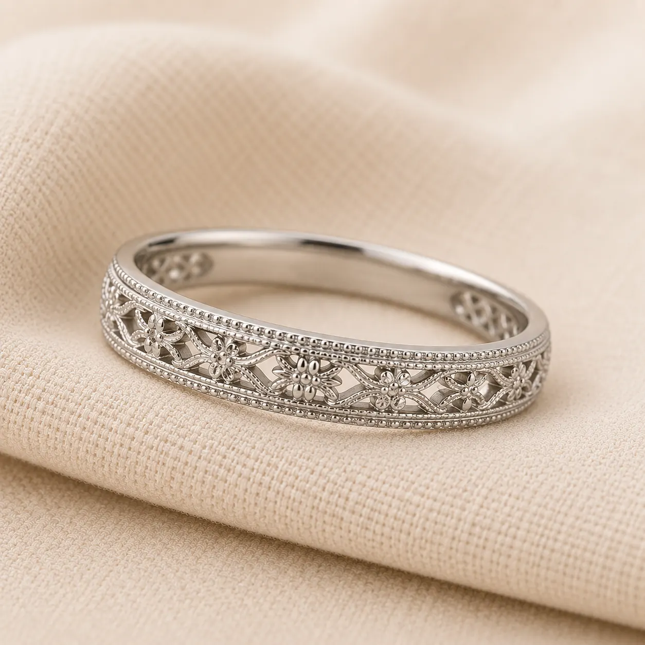 Vintage milgrain and filigree wedding band detail on cream linen at ATL Luxury Jewelry Atlanta