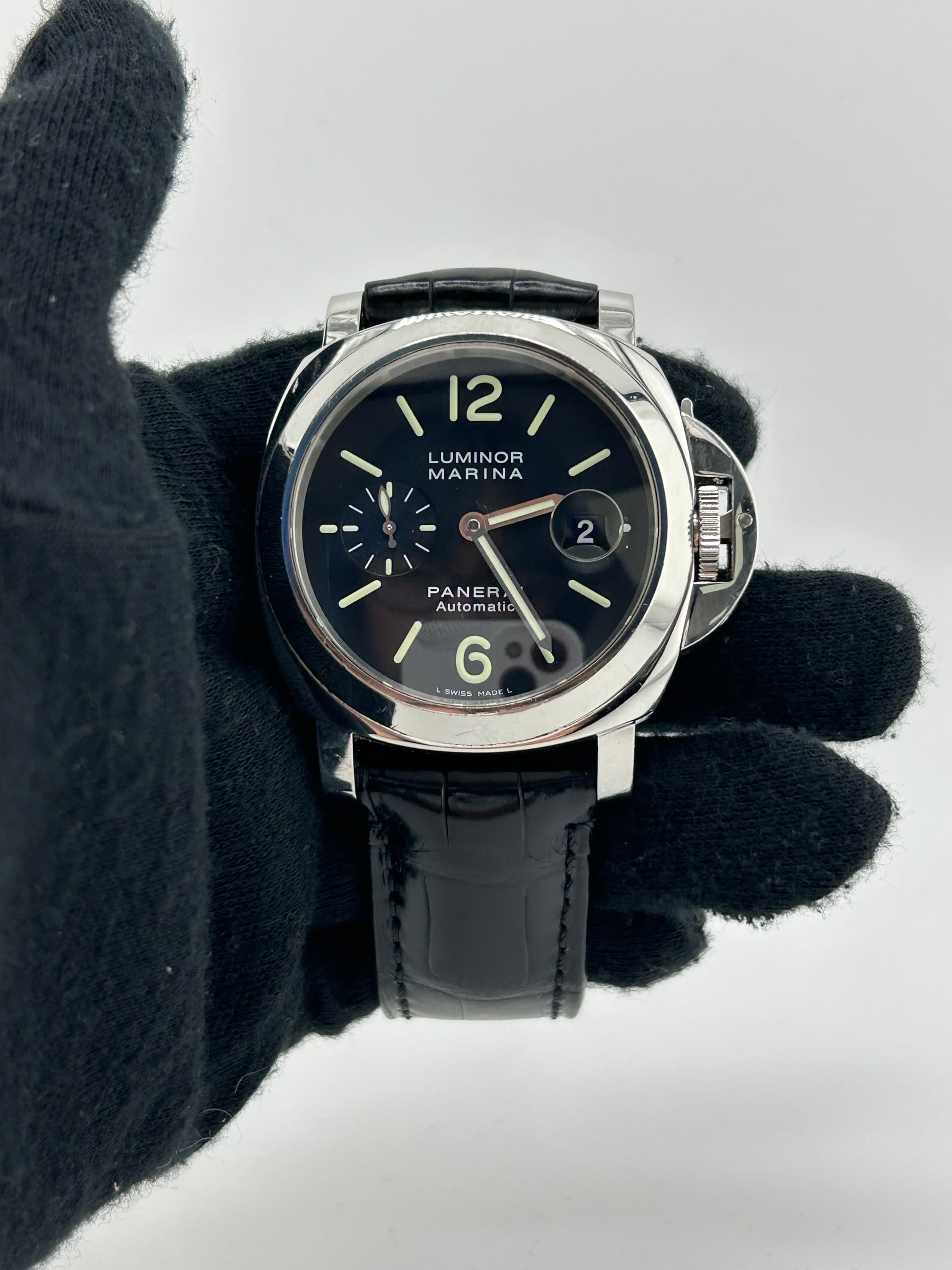 Panerai Luminor Marina Black Arabic Dial on Strap Ref. PAM00104 with Papers 2002 — 44mm Steel case, Black Arabic dial, Strap bracelet. Good, 2002.