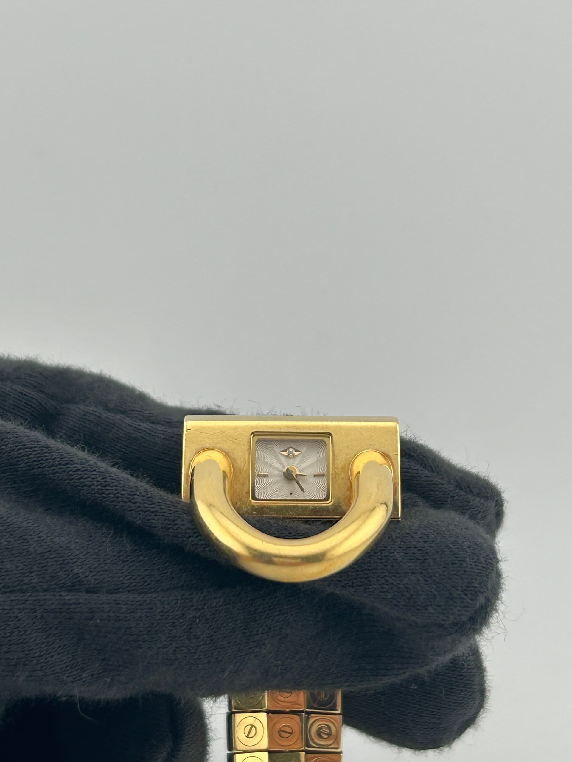 Van Cleef & Arpels Cadenas Silver Diamond Dial on 3 Row Flat Bracelet Ref. VCA 23.8X13 — 24mm x 12mm 18k Yellow Gold case, Silver Diamond dial, 3 Row Flat Bracelet bracelet. Very Good.